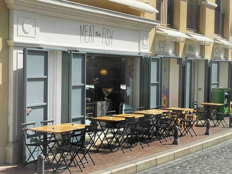 Meat the Fish Saifi facade with slate blue shutters and terrace tables